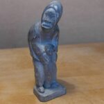Inuit Woman holding a seal - 88