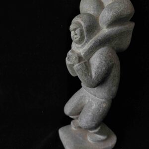 Inuit man carrying stones - 208