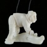 Inuit Woman flanging a seal - 1248