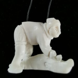 Inuit Woman flanging a seal - 1248