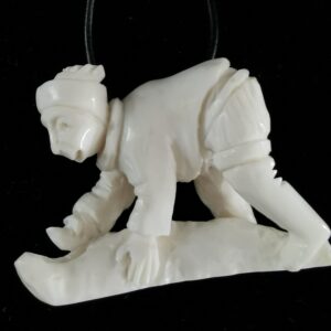 Inuit Woman flanging a seal - 1247